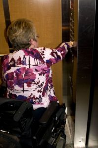 Woman using accessible elevator