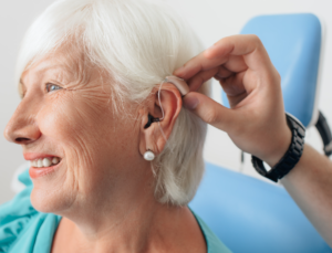 Woman being fitted with hearing aid